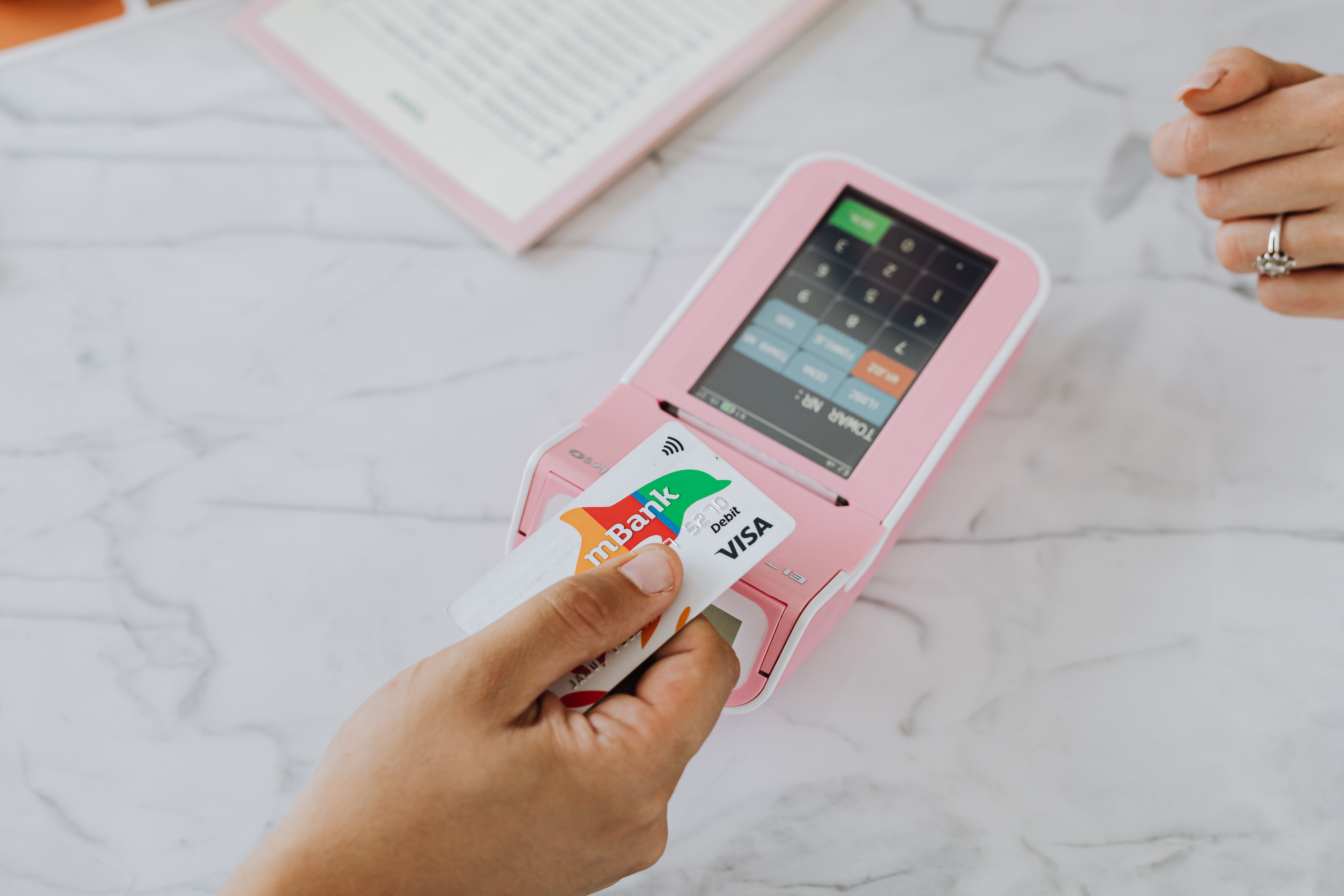 Contactless card payment representing teacher salary and teacher pay in the UK